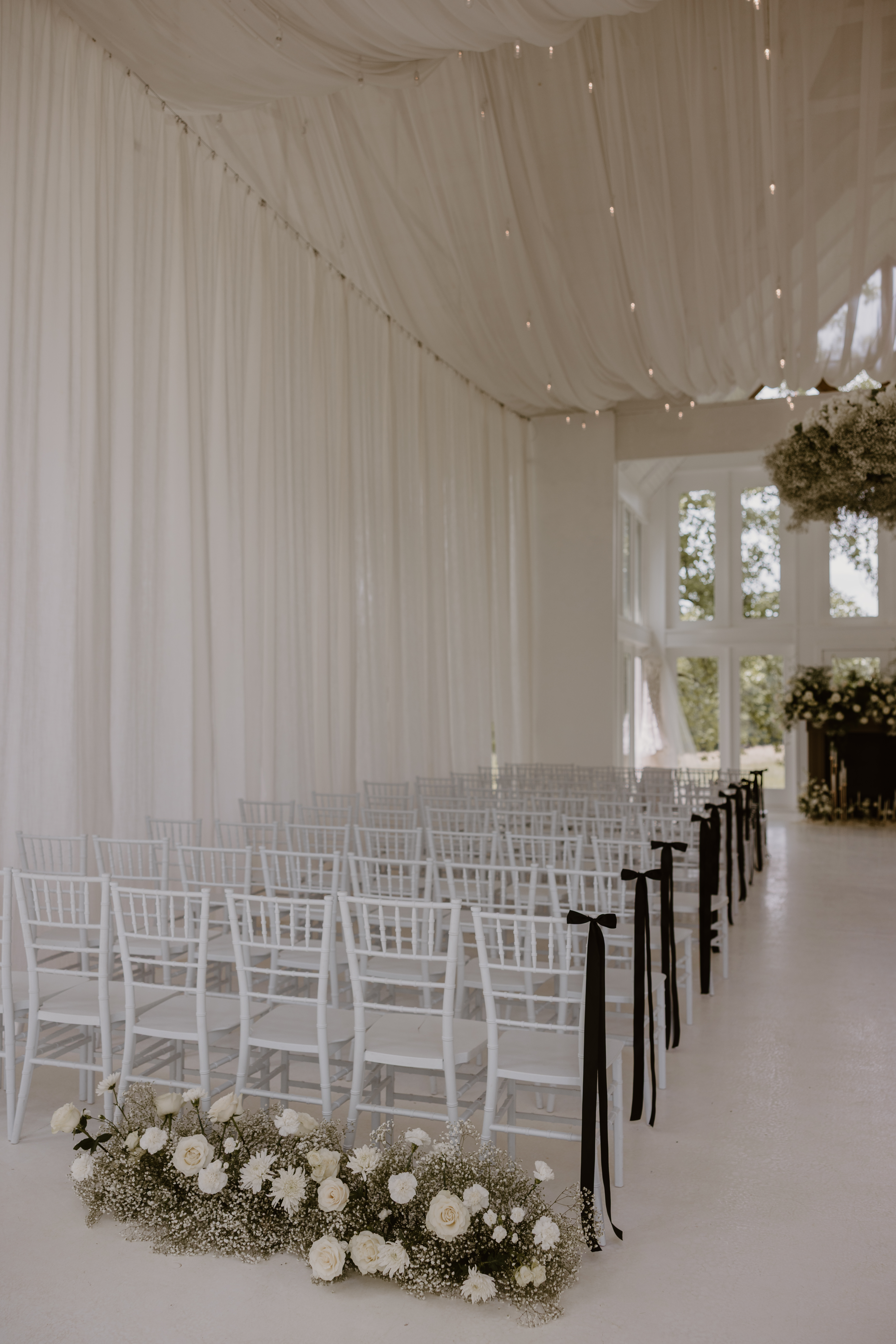 white chairs set up for ceremony.