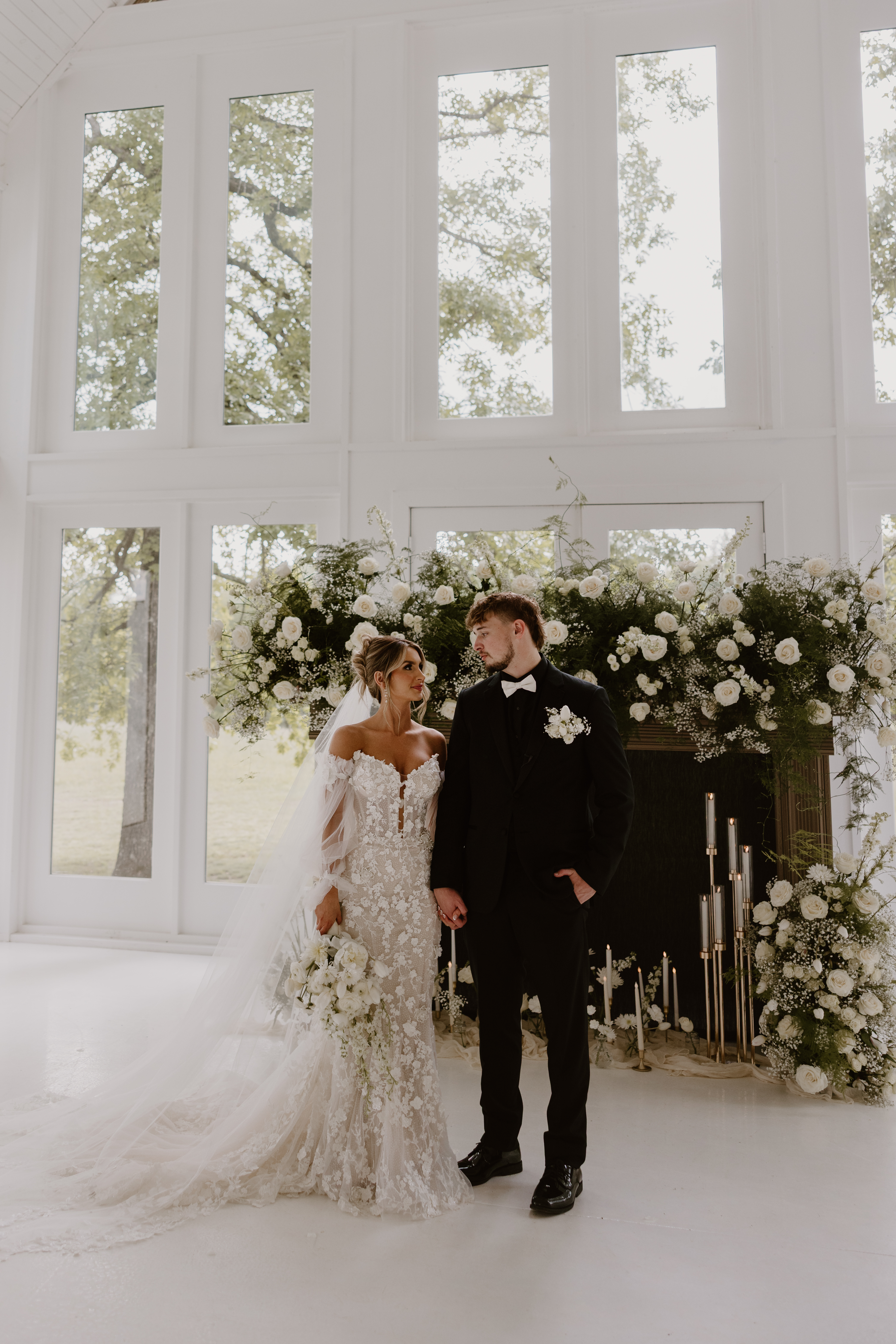 bride and groom standing in front of fireplace - photo by Allie Krauser Digitals