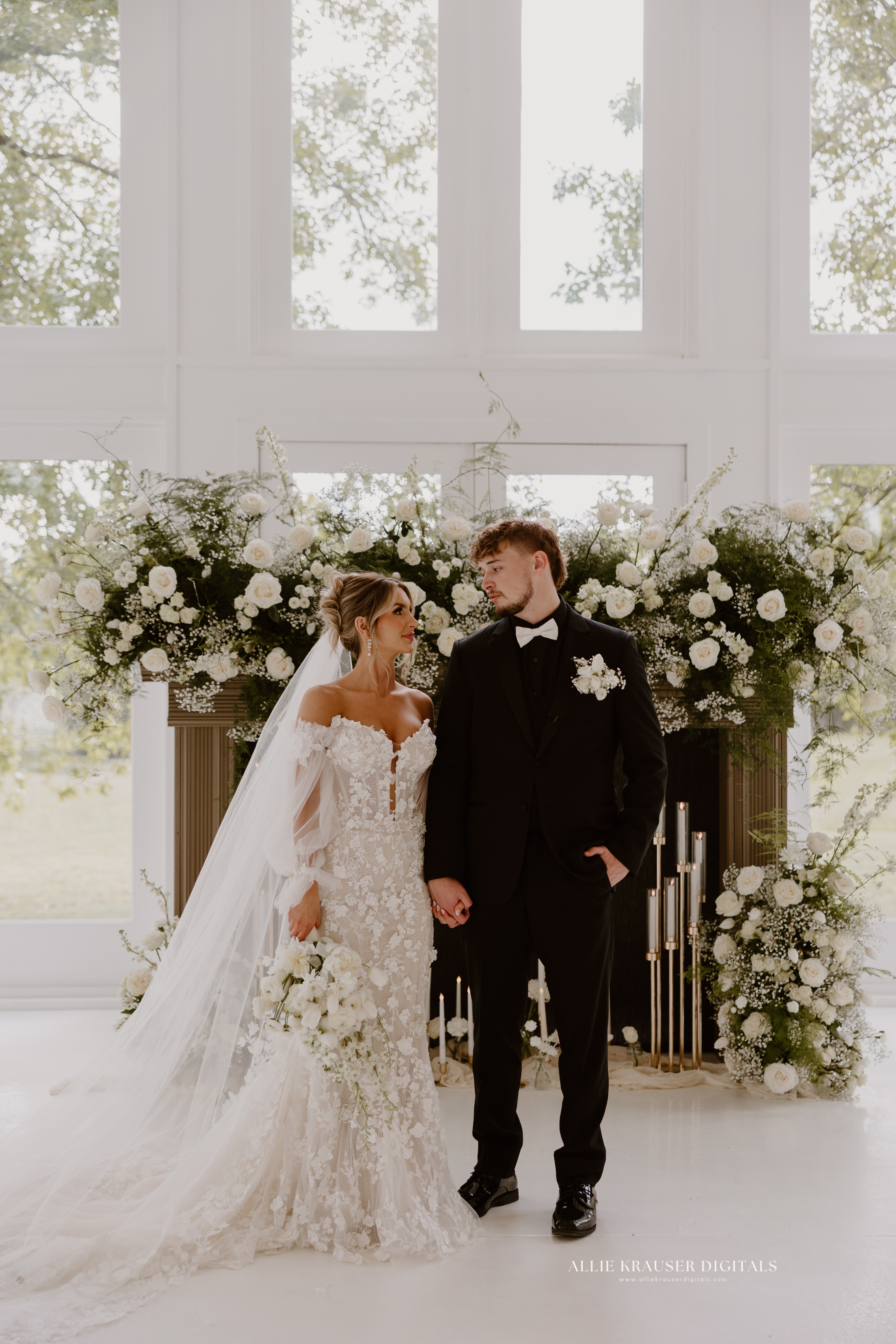 bride and groom standing in front of fireplace - photo by Allie Krauser Digitals